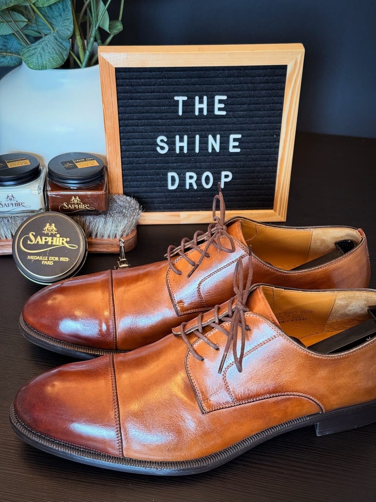 Tan cap-toe derbies after cleaning