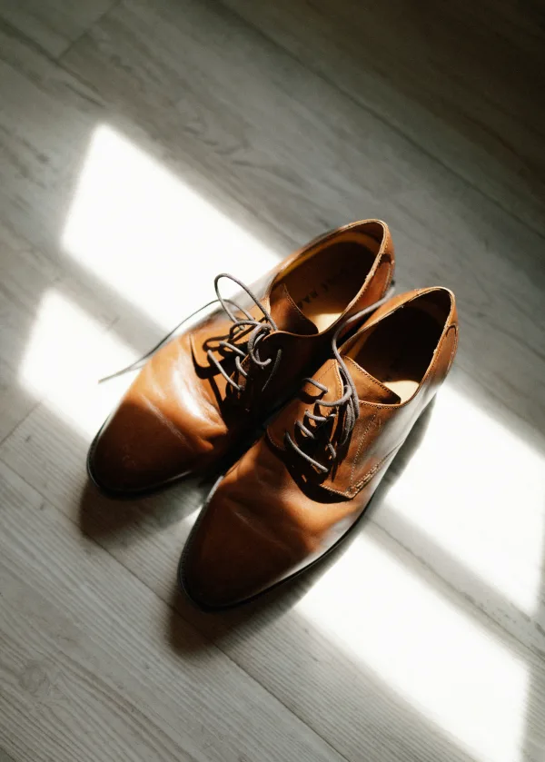 Brown dress shoes with premium leather care finish — The Shine Drop Calgary