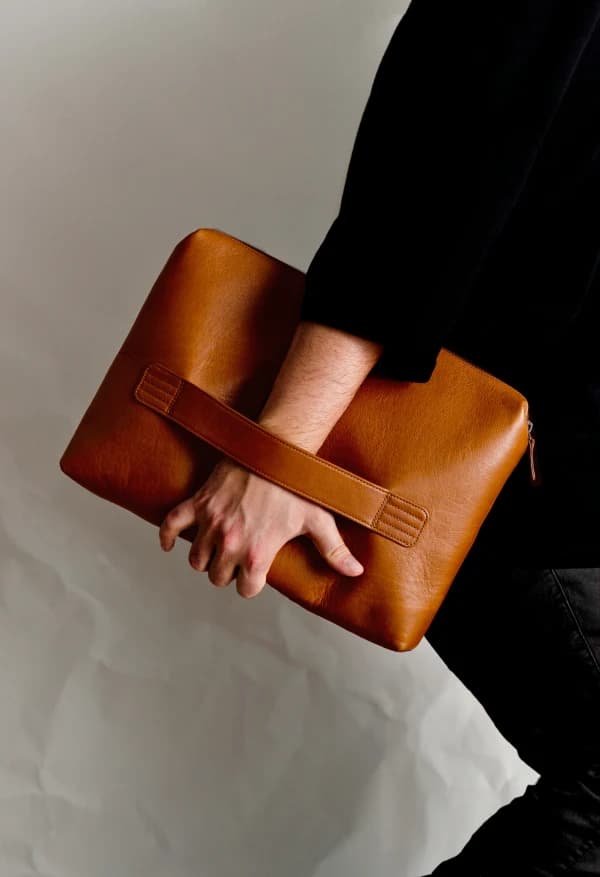 Leather clutch restored to pristine condition — The Shine Drop Calgary leather care